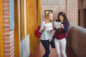 Smiling students looking at results